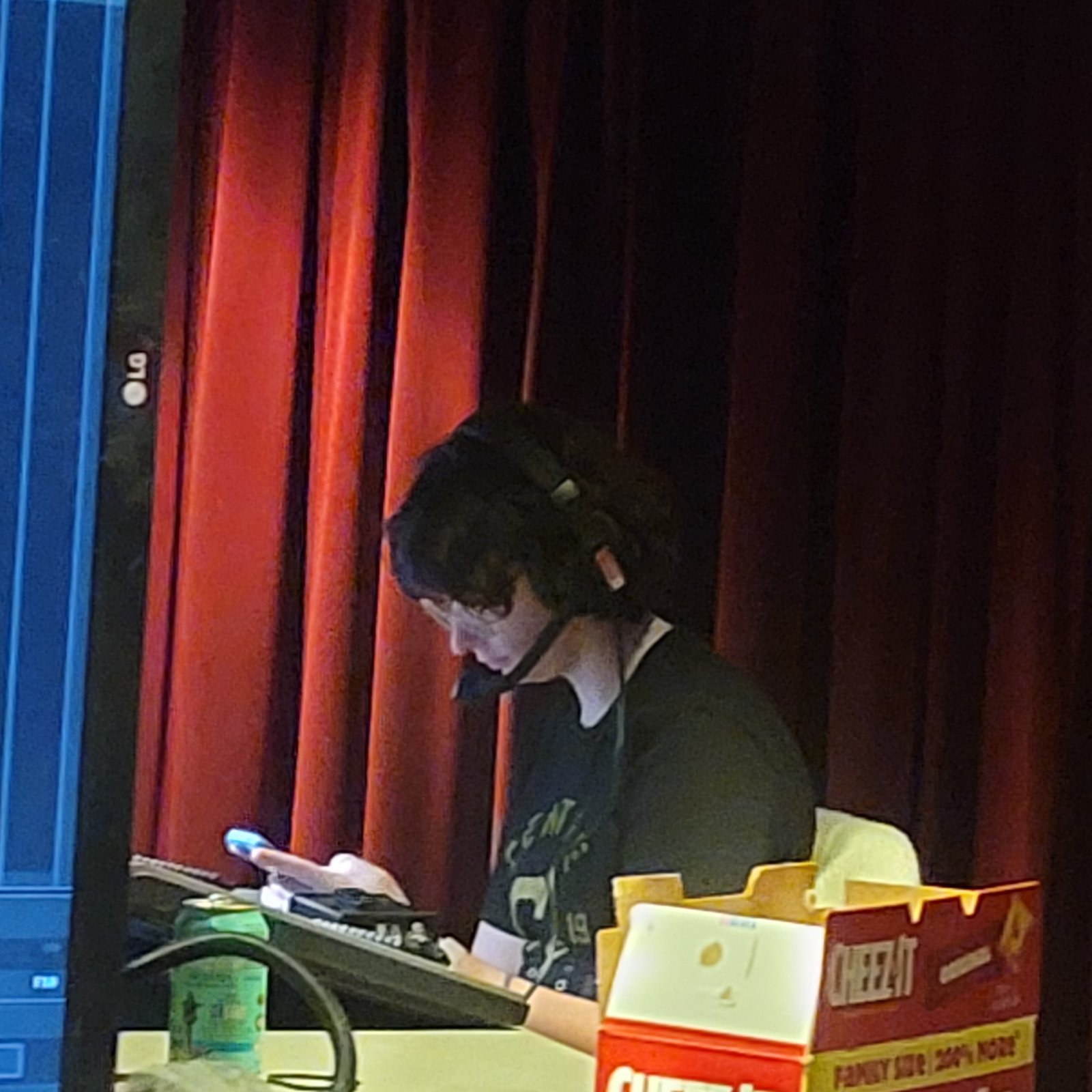 Ollie Gibson at the lighting board for The Arsonists at Centre College